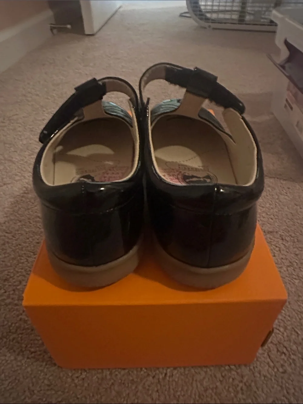 Livie & Luca Black Patent T-Strap Mary Janes with Heart Cutouts